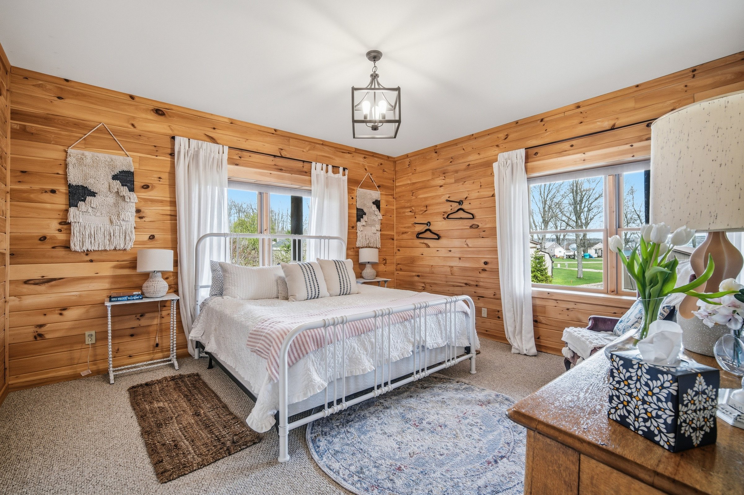 King bedroom with white iron frame