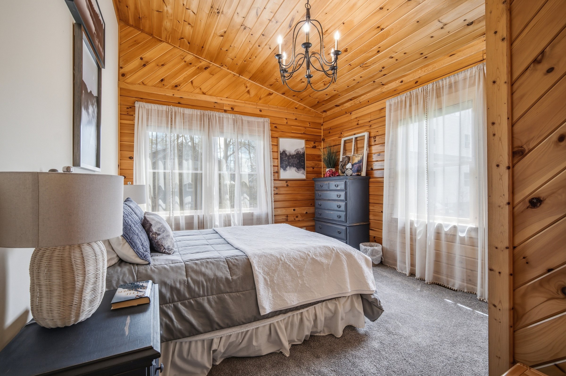 Cottage-style bedroom with chandelier